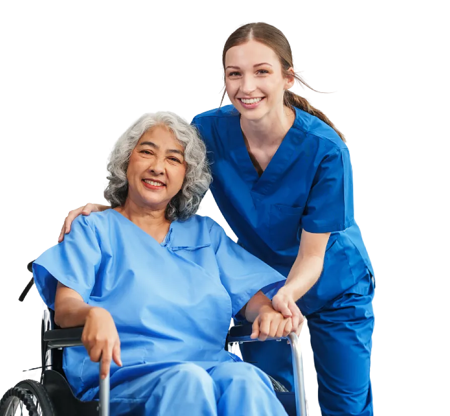 A smiling caregiver standing beside a client seated in a wheelchair